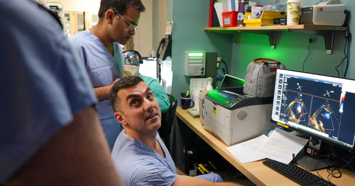 Rony Lahoud, MD and Tanush Gupta, MD, look at imaging