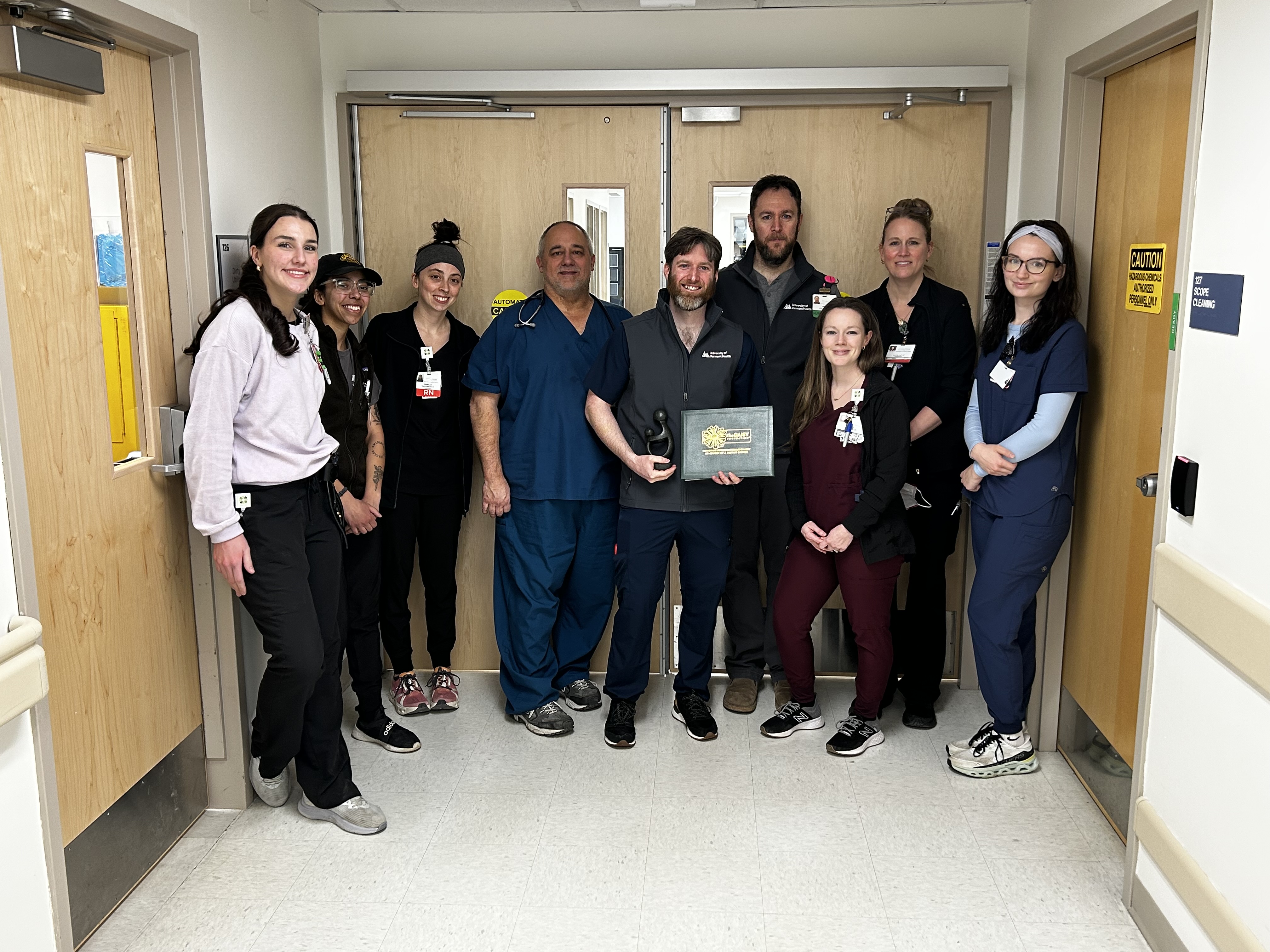 The Emergency Department team at Elizabethtown Community Hospital celebrates the DAISY Award presented to colleague Judd Collier, RN during a surprise ceremony. The DAISY Award recognizes nurses who make a meaningful difference in the lives of their patients and is based on nominations from patients, families and co-workers.