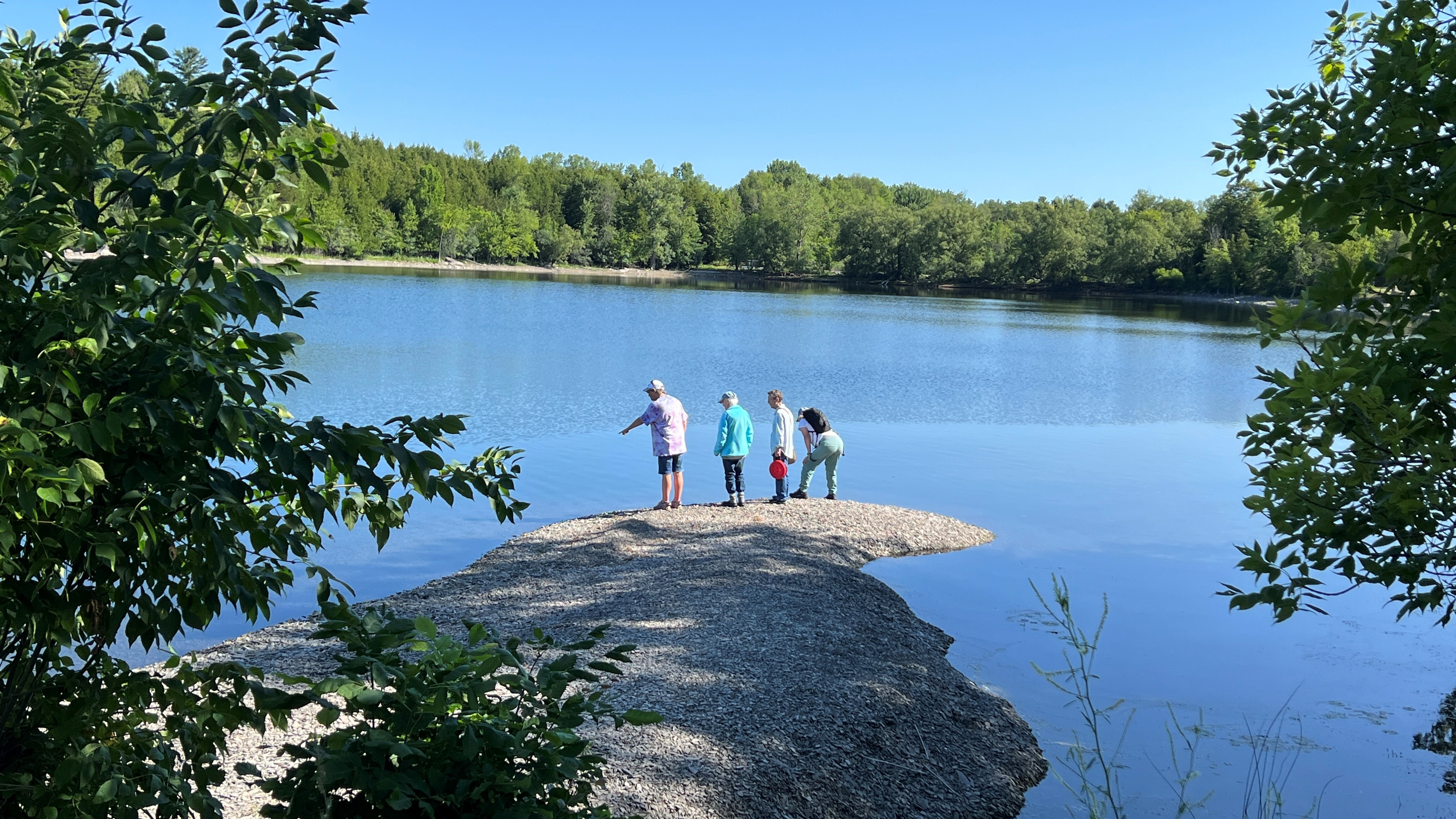 Participants of a previous Nature-Based Approach to Living Beyond Cancer group explore Lake Champlain’s shoreline. 