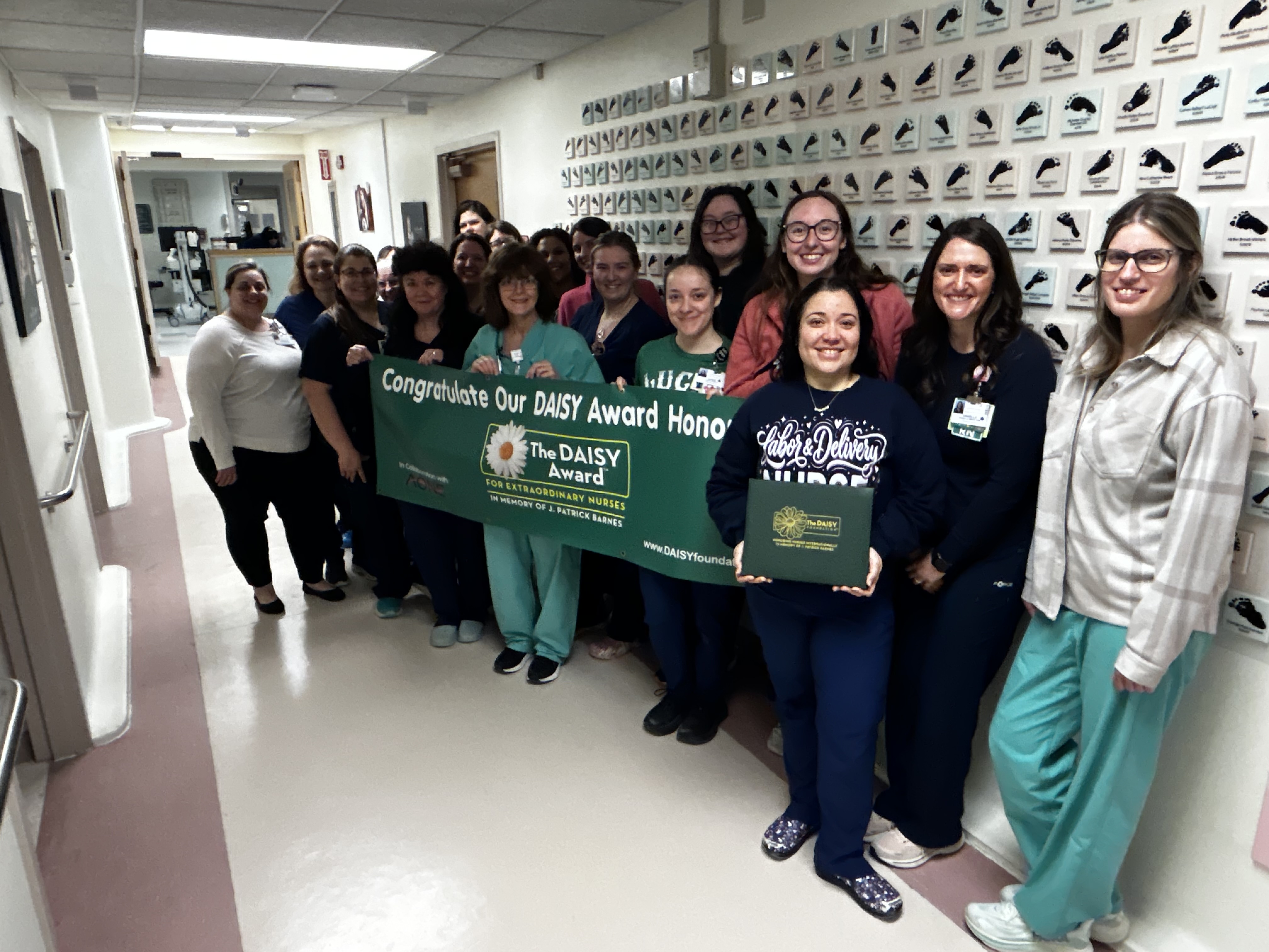 The Labor and Delivery team at Champlain Valley Physicians Hospital celebrates the DAISY Award presented to colleague Cindy Tate-Gutierrez, RN during a surprise ceremony. The DAISY Award recognizes nurses who make a meaningful difference in the lives of their patients and is based on nominations from patients, families and co-workers.