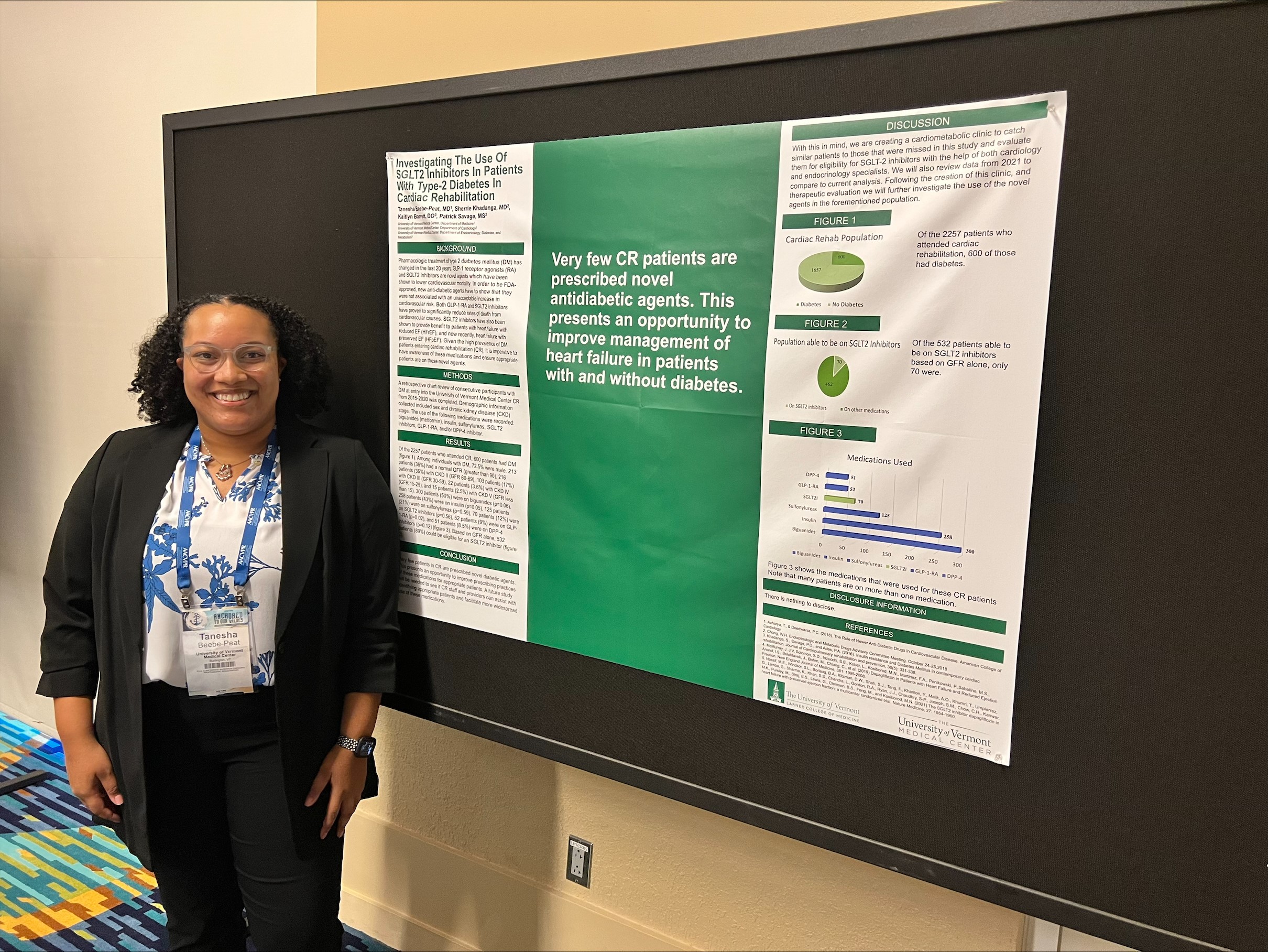 GME Internal Medicine Resident standing in front of research poster