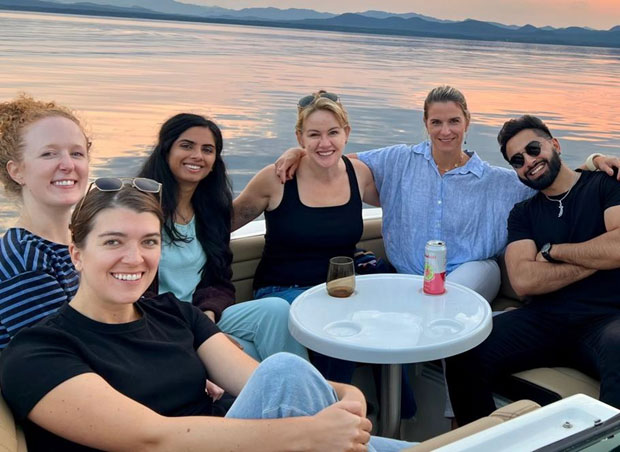 Reproductive Endocrinology and Infertility Fellows sitting with Lake Champlain in background