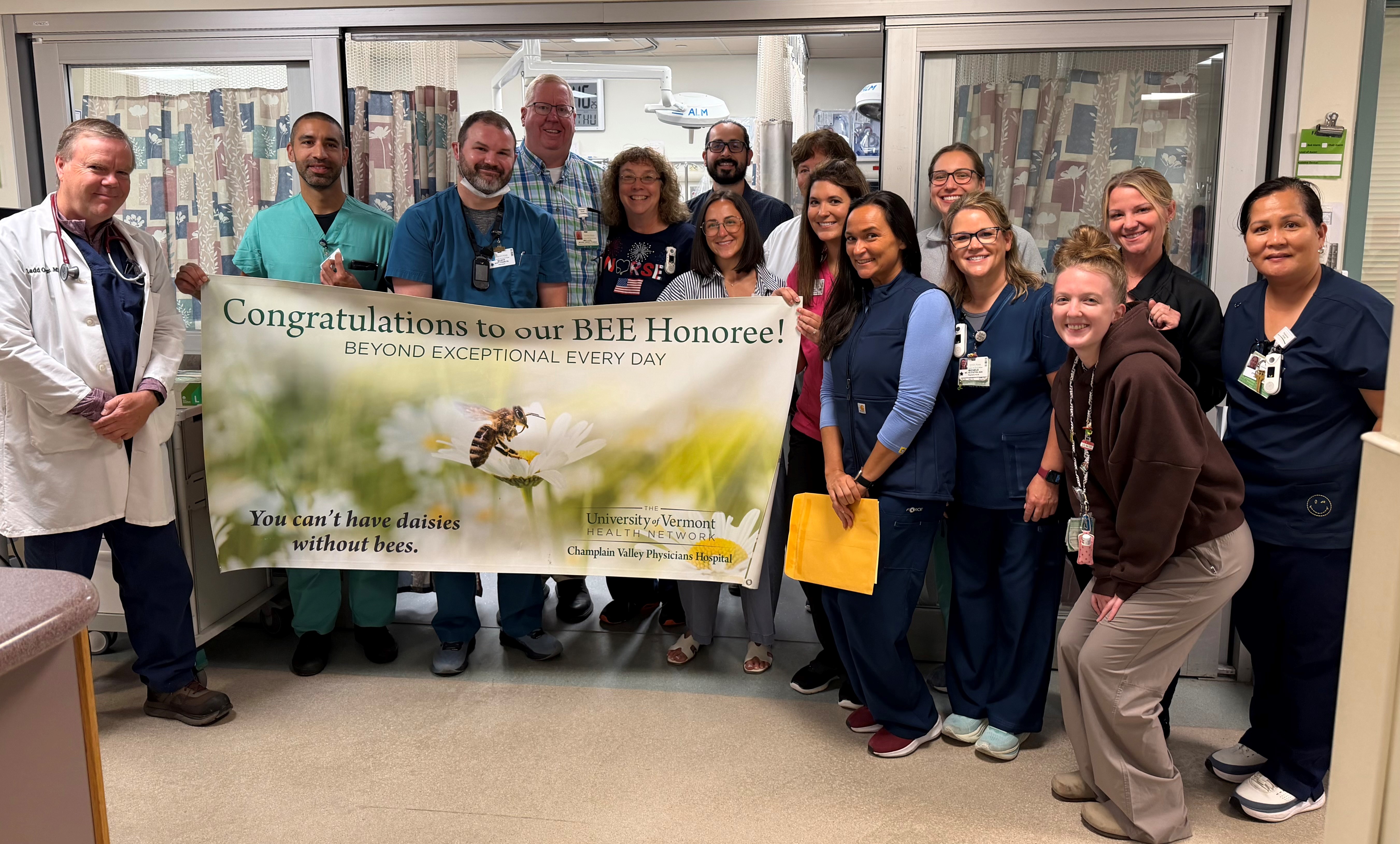 Scott Charette, a pharmacist at Champlain Valley Physicians Hospital, was surprised as the most recent BEE Award honoree during a ceremony with his Emergency Department co-workers.
