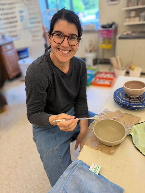 Erica Lash making pottery