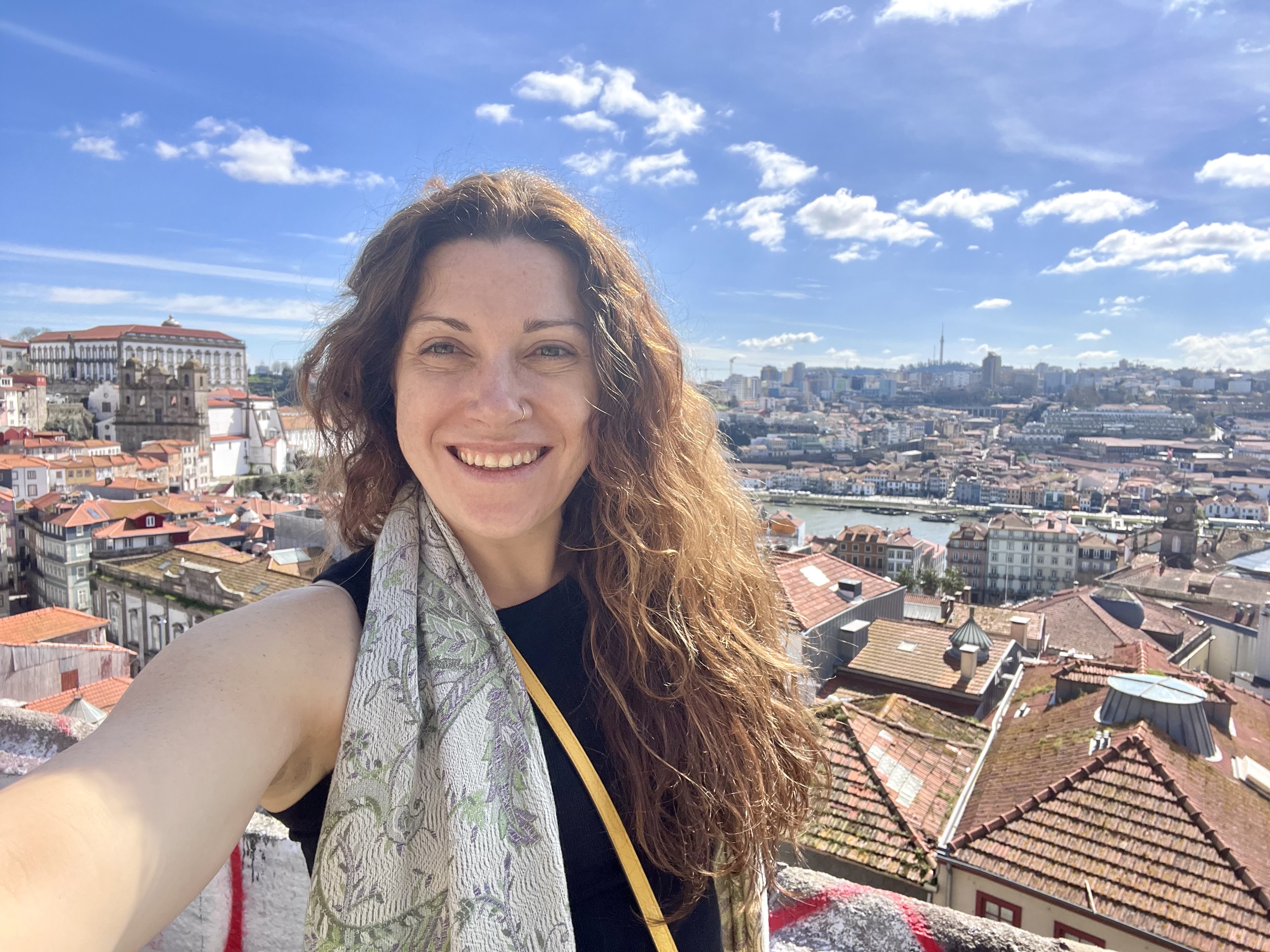 Alenna Beroza, MD in front of a city with tiled red roofs
