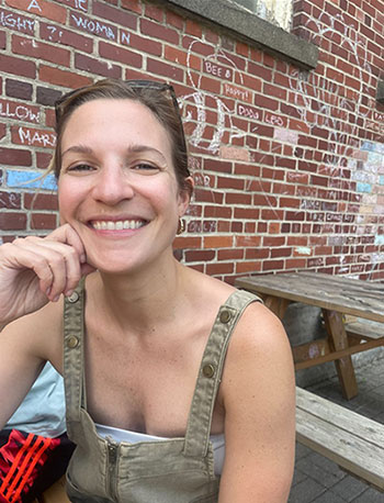 Lindsey Pileika, MD sitting at picnic table