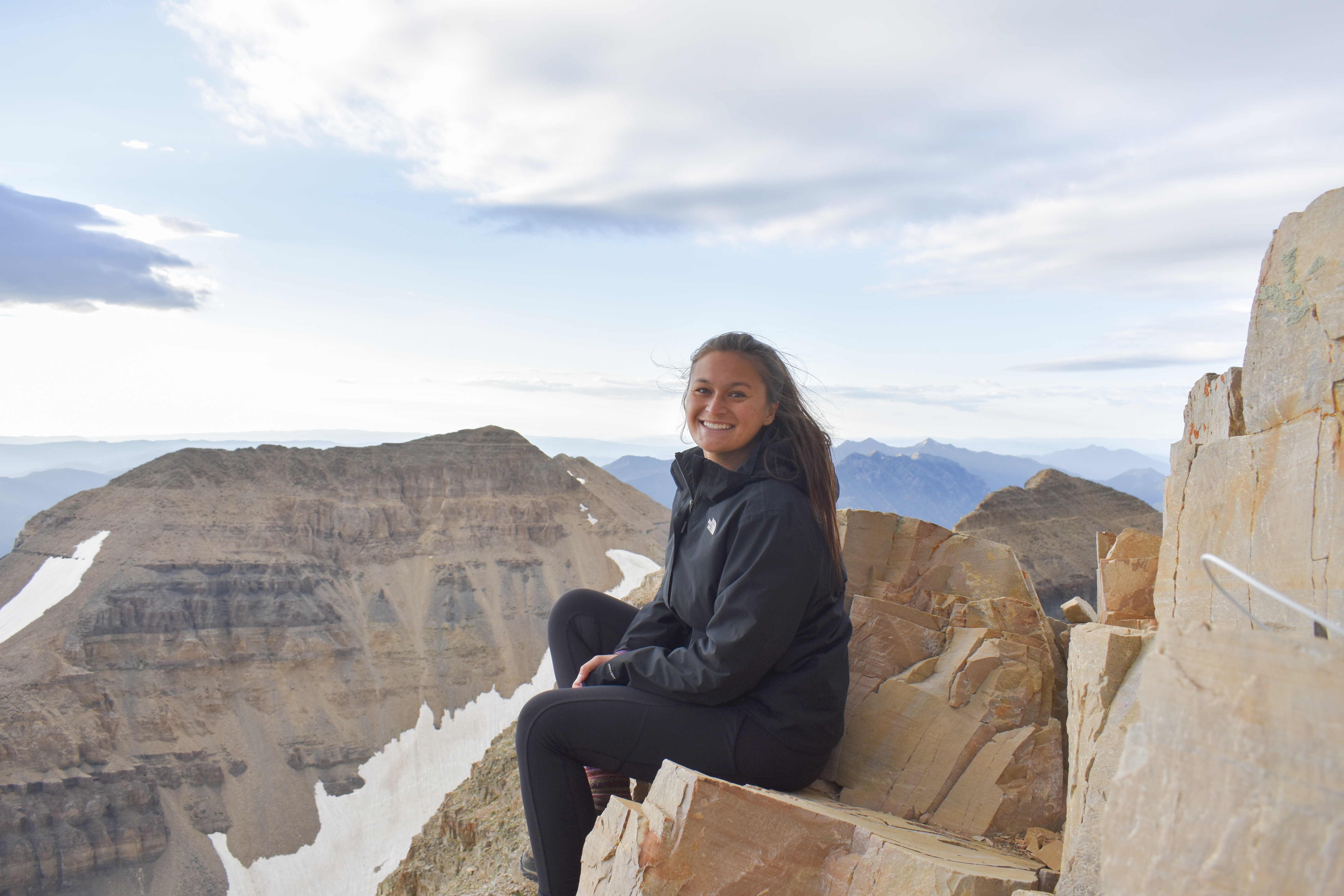 Presley Azarcon, MD sitting high in mountains