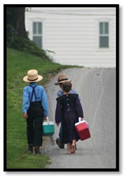 Amish children walking on rural road