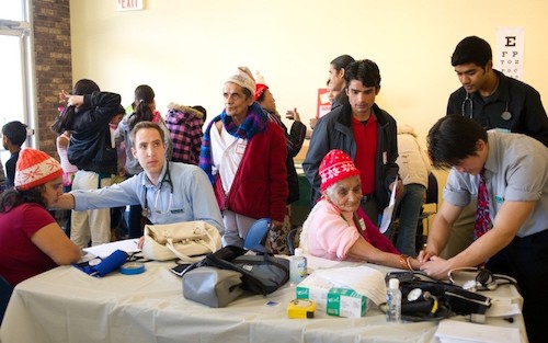 UVMMC physicians providing medical exams to refugees