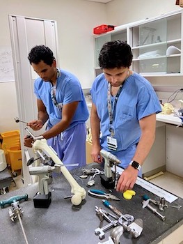 Two orthopedic residents in UVM Medical Center simulation lab.