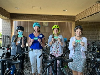 UVM Pediatric Neurosurgery team poses with bikes and helmets.