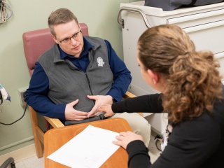 A patient meets with an ostomy care specialist. 