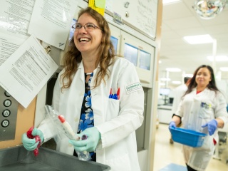 Two medical providers smile.