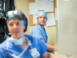Two surgeons prepare for a surgery.