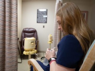 A mother uses a breast pump in the Alice T. Miner Women & Children's Center at Champlain Valley Physicians Hospital.