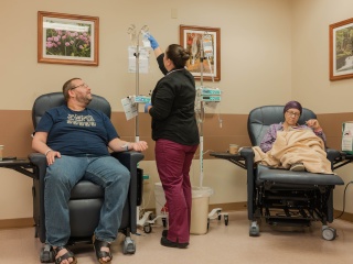 AHMC Reddy Cancer Center patients have chemotherapy adjusted by an Alice Hyde Medical Center nurse.