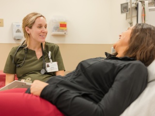 Nurse Marissa St. Pierre, RN, helps a patient.