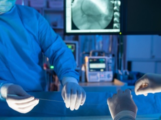 Close-up of medical professionals prepping for a surgery,