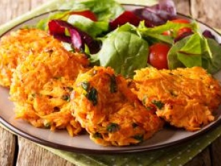 Close-up of a bowl of root vegetables latkes. 