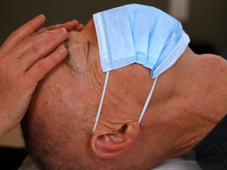 A patient gets reiki at the University of Vermont Medical Center's Comprehensive Pain Program.