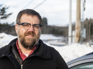 Ian Campbell stands outside for a photo.
