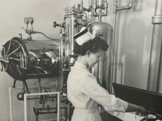 Historical photo of nurse with surgical instruments at Porter Medical Center.