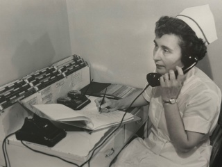 Historical photo of nurse on the phone at Porter Medical Center.