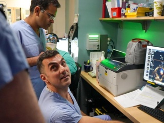 Rony Lahoud, MD and Tanush Gupta, MD, look at imaging