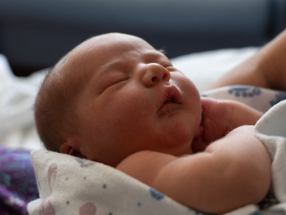 Close-up photo of a newborn baby.