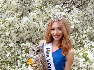 Portrait of Sophia Parker, Miss Vermont, standing with an owl.