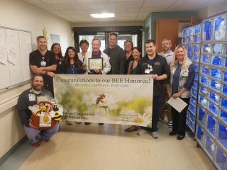 Ladd Osborne, MD, an emergency physician at Champlain Valley Physicians Hospital, was surprised as the most recent BEE Award honoree during a ceremony with his co-workers.
