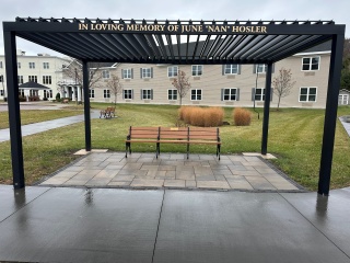 A new pergola with bench at The Alice Center at Alice Hyde Medical Center.