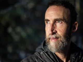 Kurt Budliger, a Vermont photographer, poses for a photo.