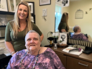Stylist Jess Rheaume with resident Inez Martel at the Helen Porter salon.