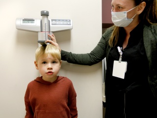 A pediatric patient has his height measured at Alice Hyde Medical Center Pediatrics in Malone, NY.