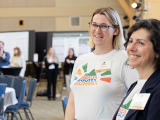 Taylor Small smiles for a photo at the Health Equity Summit in Burlington.