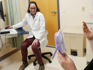 Colleen Horan, MD, discusses menopause symptoms with a patient.