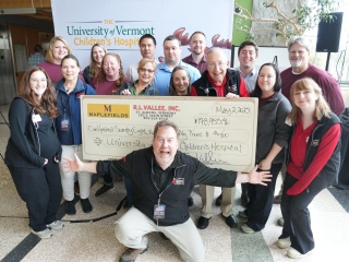 Group photo of Maplefield's staff and Golisano Children's Hospital for Big Change Round Up.