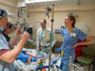 UVM Medical Center Chief Perfusionist Paul Hunter (far left) works a simulation with physicians Katelin Morrisette (left), Skyler Lentz (center) and critical care nurse Alicia Imbergamo (right).