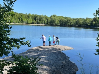 Participants of a previous Nature-Based Approach to Living Beyond Cancer group explore Lake Champlain’s shoreline. 