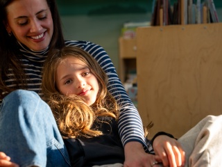 Eliza Andrews sits with her mother, Hillary, at Golisano Children's Hospital.