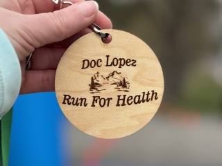 Up close on a badge of the doc lopez run for health.