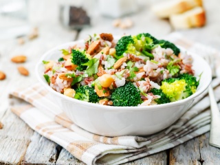 Bowl of broccoli, rice and nuts. 