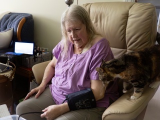 Laurel Schoop takes her blood pressure at home with automated devices provided by University of Vermont Health - Home Health & Hospice’s Remote Patient Monitoring Program.