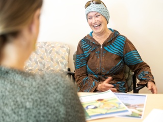 A medical professional talks to a patient.