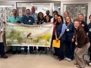 Scott Charette, a pharmacist at Champlain Valley Physicians Hospital, was surprised as the most recent BEE Award honoree during a ceremony with his Emergency Department co-workers.