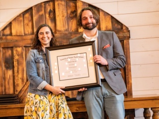 CVPH Family Medicine Residency Faculty member Delaney Osborn, MD, left, presents graduate Nicholas Rzepski, MD with his certificate of completion at the Residency’s commencement ceremony held June 19 at the Rainbow Banquet Hall, Altona. Dr. Rzepski, who has joined Hudson Health Headwaters, was one of seven graduates celebrated at the event. 
