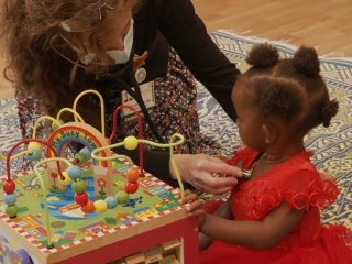 Resident interacting with a young girls
