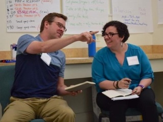 Two people in conversation at workshop