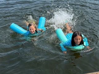 Two girls swimming